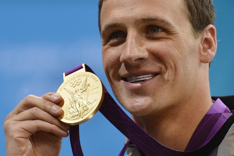 US swimmer Ryan Lochte poses on the podi